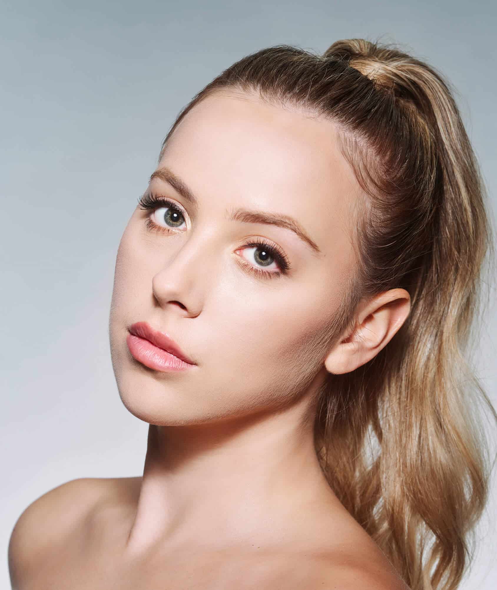 Client model with refreshed, radiant appearance following Full Face Refresher® at Allure Aesthetics