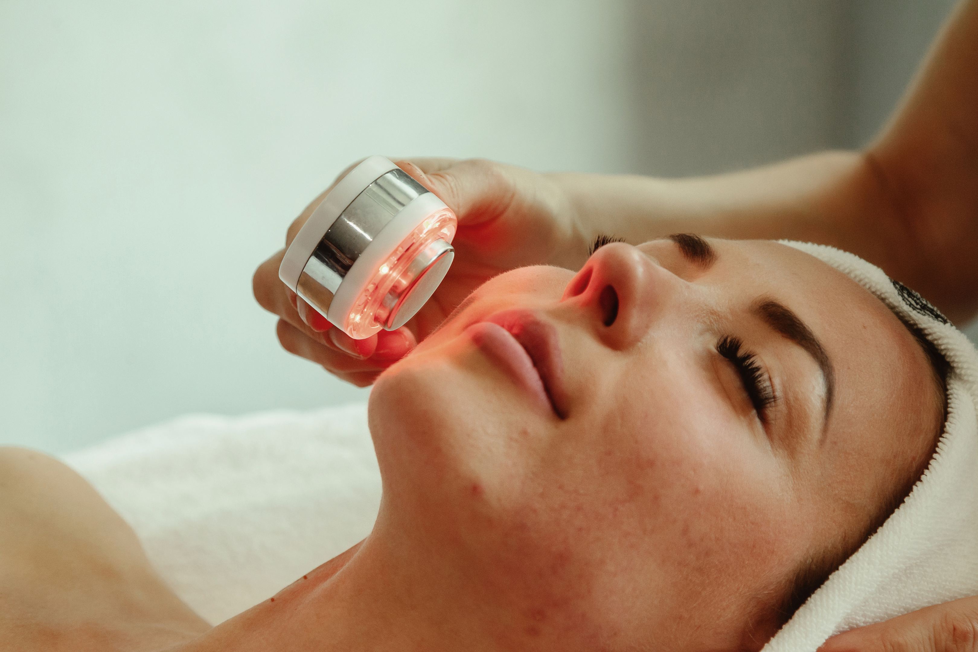 Phototherapy LED laser being used on a woman's face