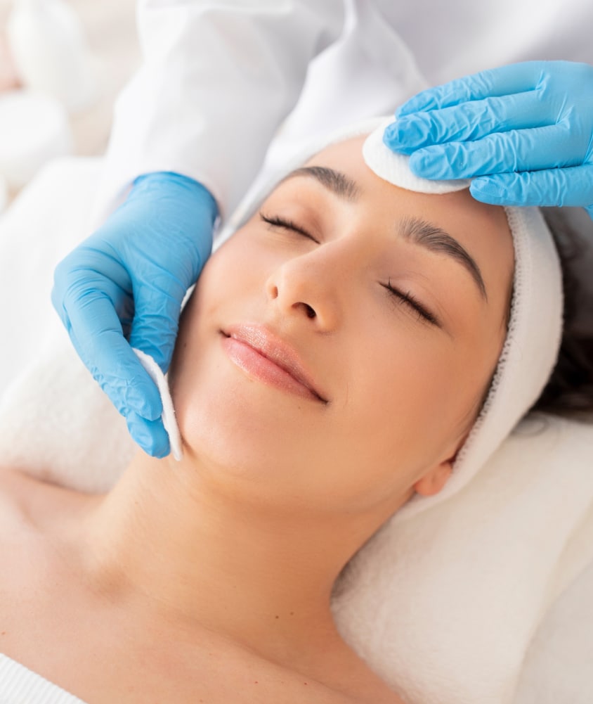 Woman receiving a professional facial at Allure Aesthetics, symbolizing results-driven skincare available in King of Prussia, Philadelphia, and the Main Line