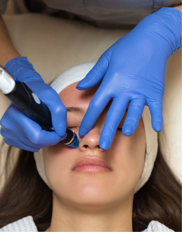 Woman receiving a HydraFacial while lying down